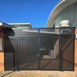 Perforated mesh used as the infill in this custom security gate solution