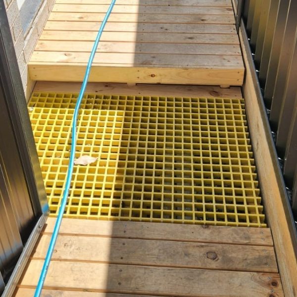 Webforge Locker -G256IGY1-Fabricated and installed by Croning Group to allow storm water to drain through the deck